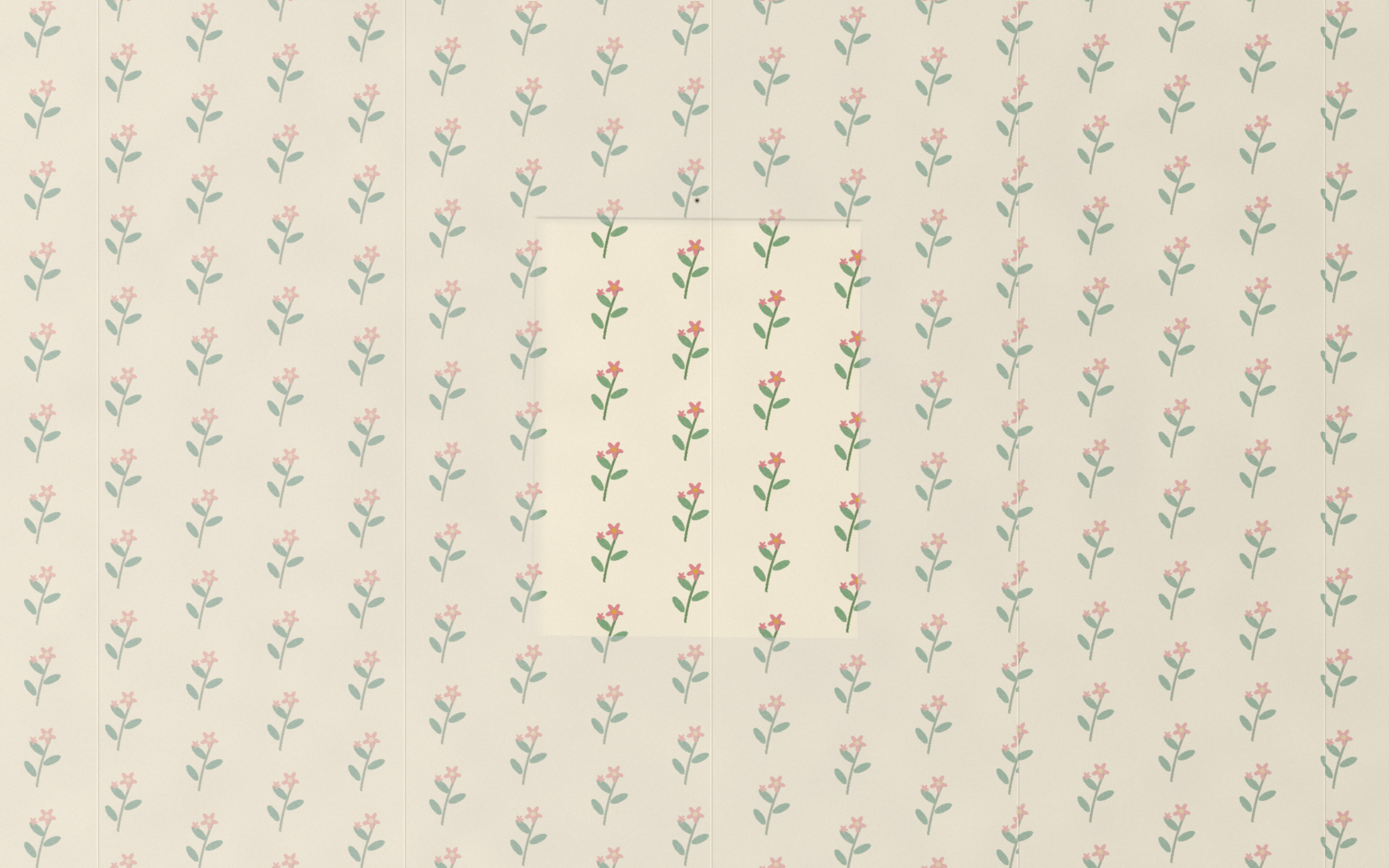Wallpaper with small pink flowers on green stems, faded everywhere to grey-blue and buff except for one tall rectangle where the colours are still bright. A nail hole above it.
